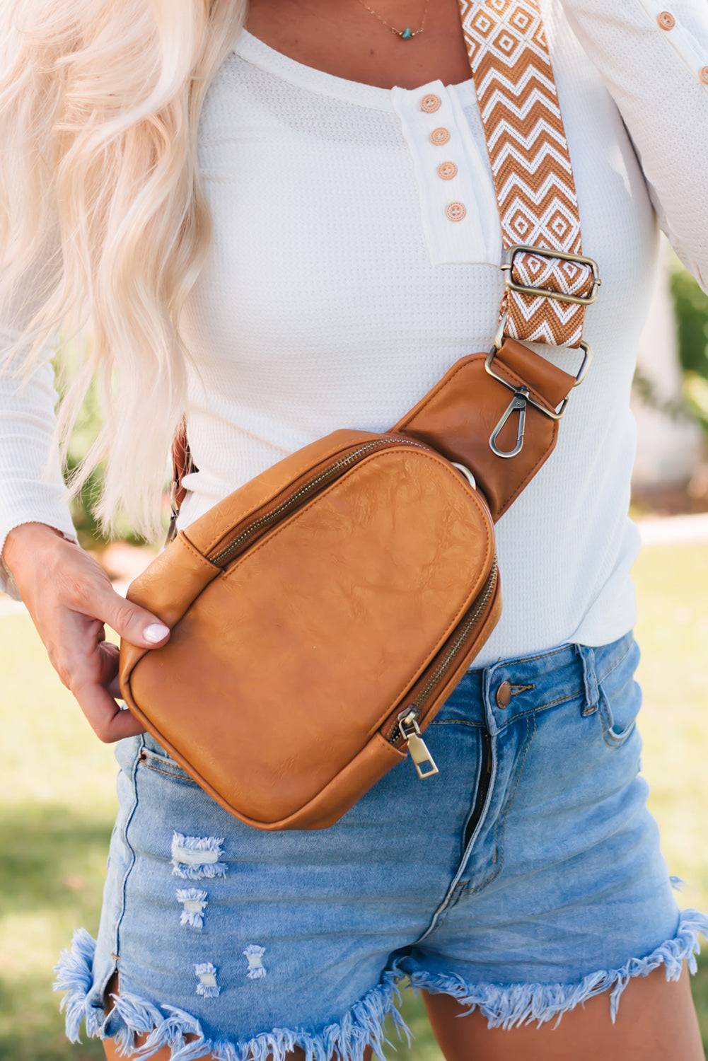 Stylish brown faux leather crossbody bag with secure zip closure