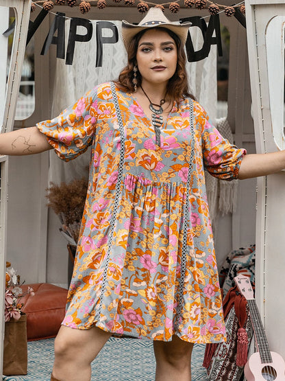 Plus Size Ruched Printed Half Sleeve Mini Dress.