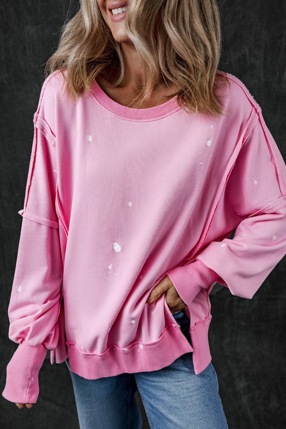 Exposed Seam Round Neck Long Sleeve Sweatshirt.