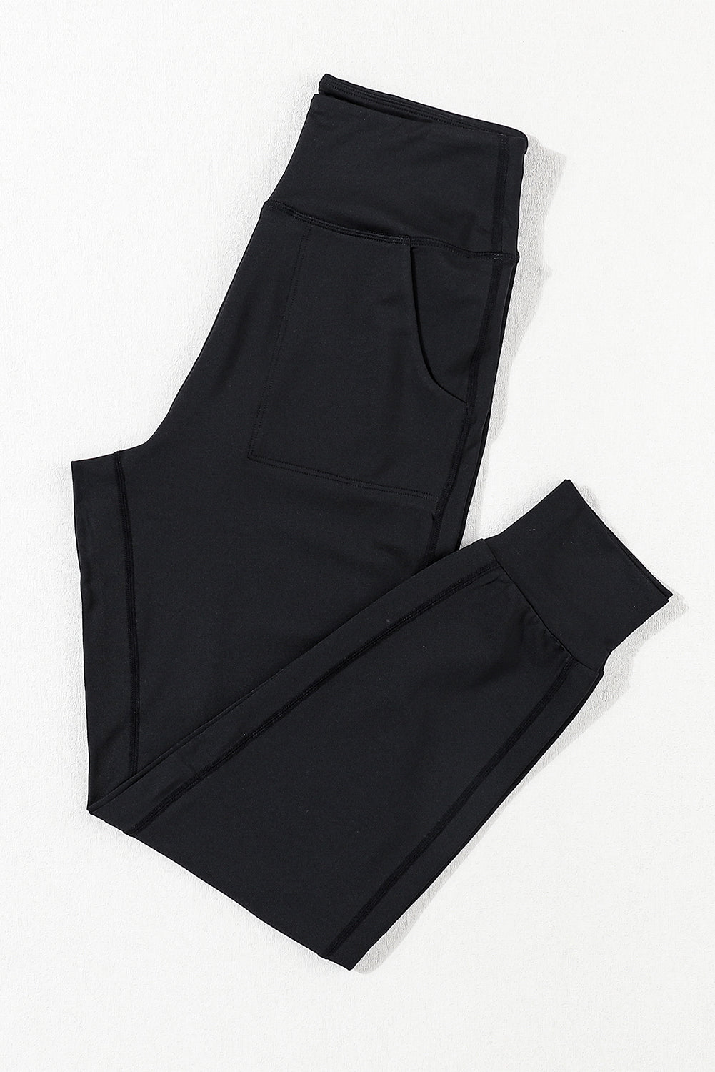 Modern high-waisted joggers with exposed seams and pockets