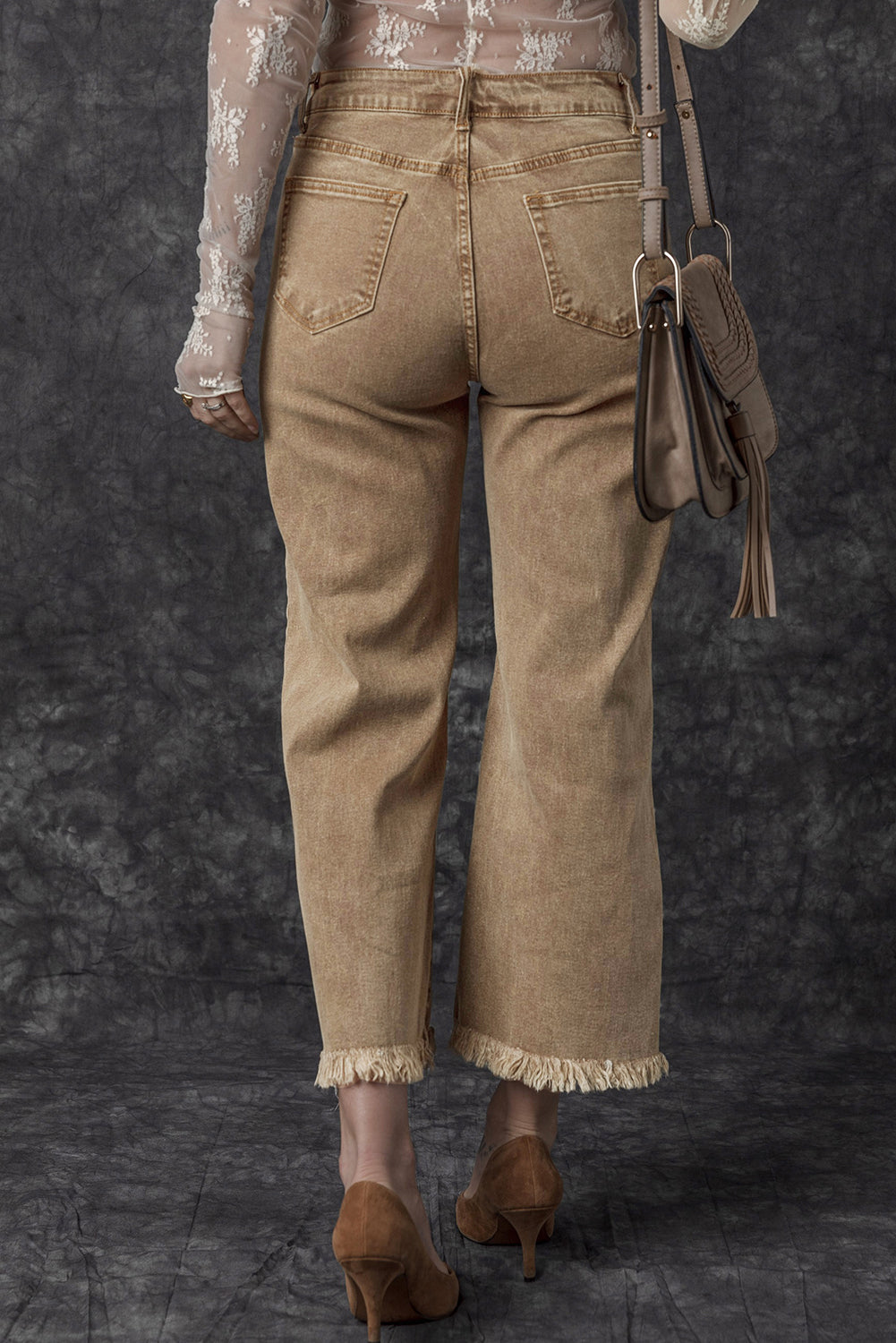 Chic light beige high-rise cropped wide-leg jeans with frayed hem