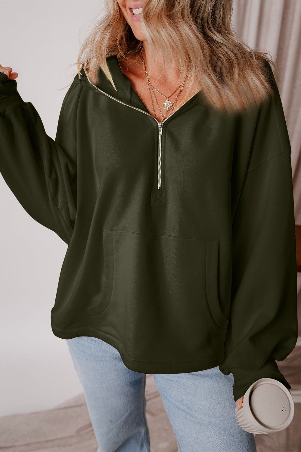 Pocketed Half Zip Dropped Shoulder Hoodie.