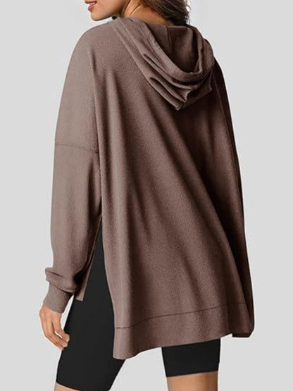 Sleek pocketed hoodie with drawstring and side slit