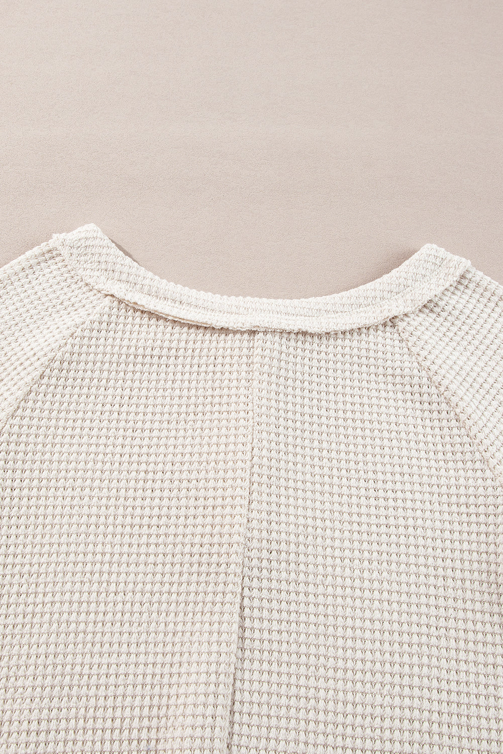 Cozy oatmeal waffle knit blouse with buttoned front and raglan sleeves