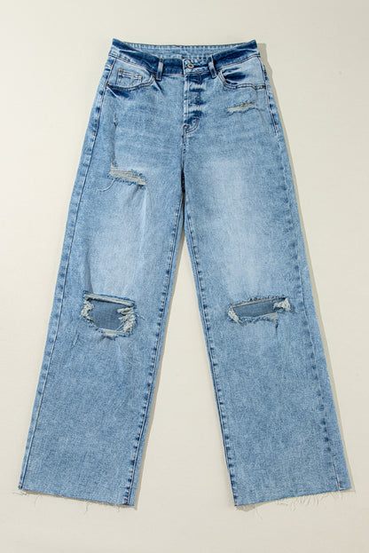 Trendy light blue distressed straight leg jeans with raw hem