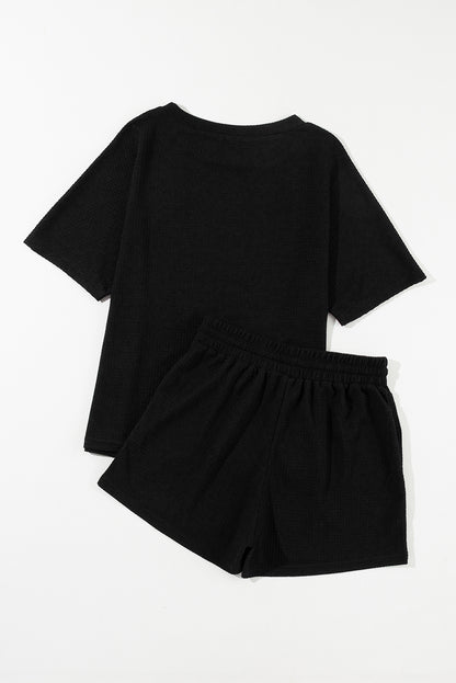 Chic black waffle knit tee and shorts ensemble