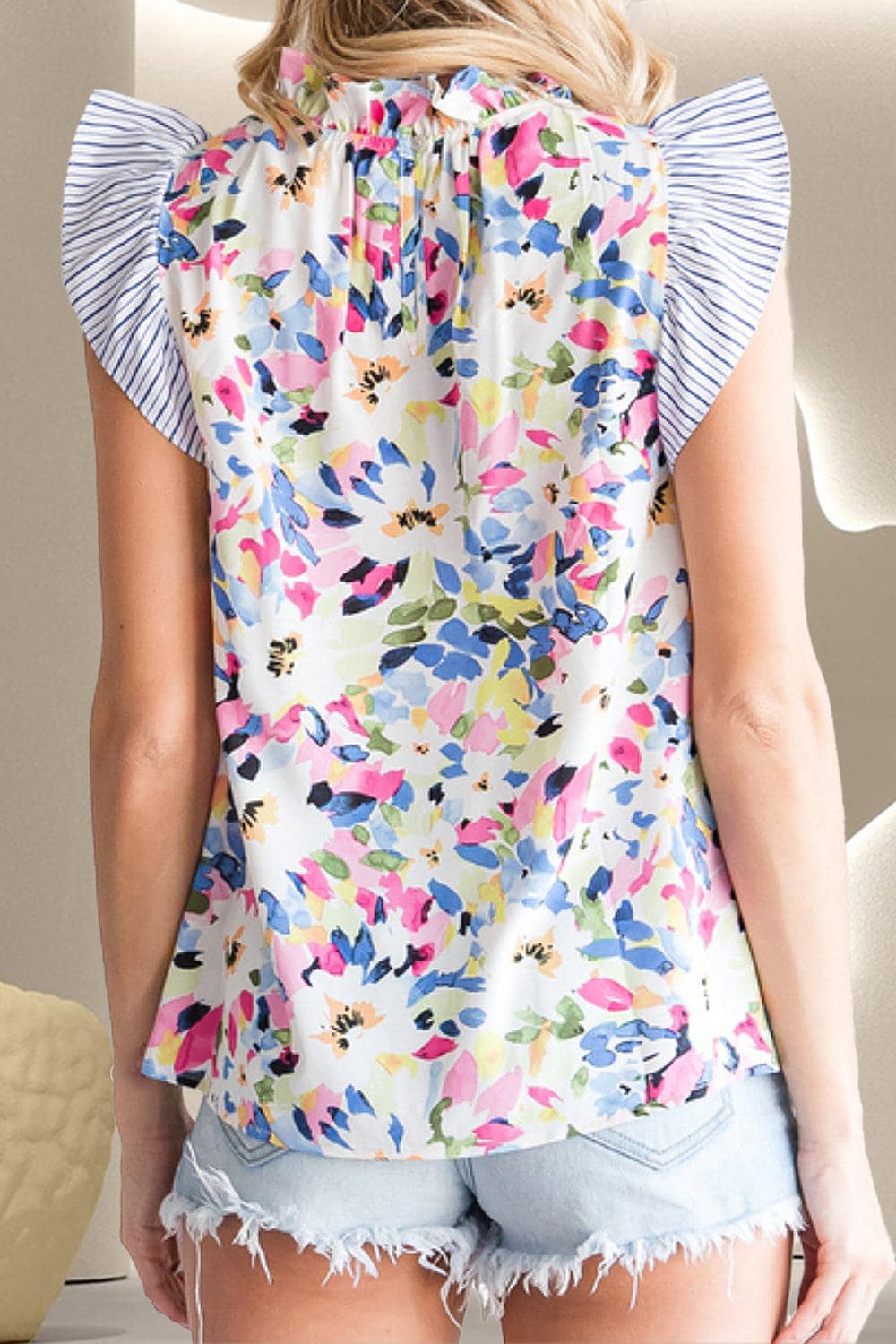 Ruffled Printed Mock Neck Cap Sleeve Blouse.