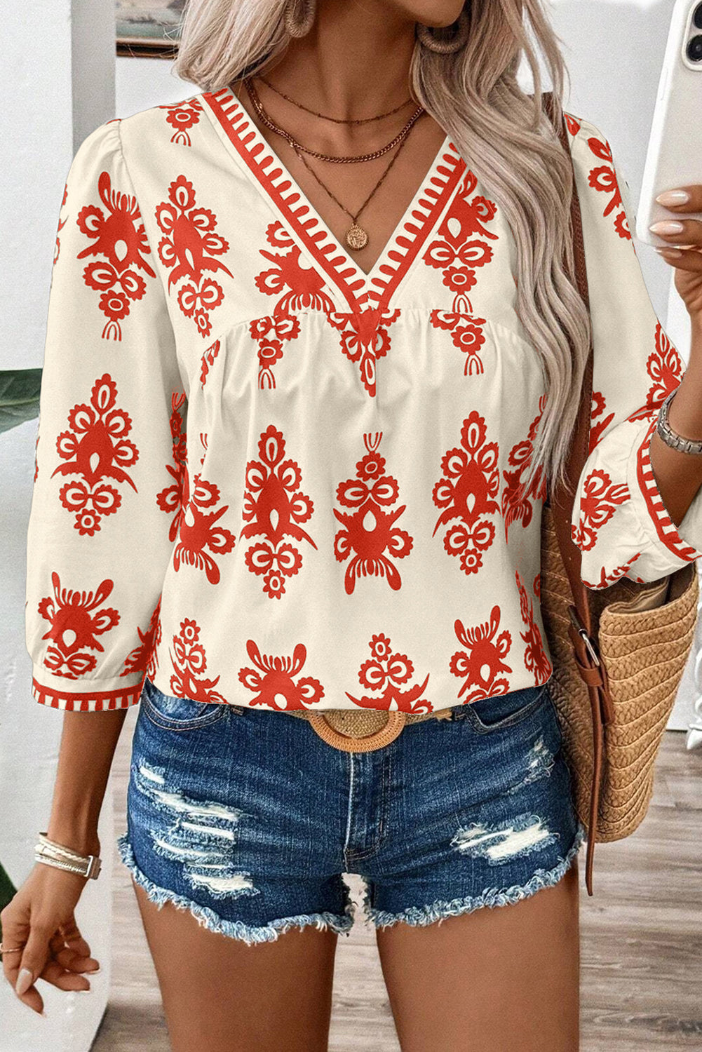 Chic orange geometric print V-neck blouse with 3/4 sleeves