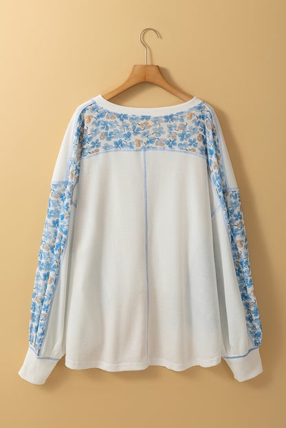 Chic white floral patchwork batwing blouse with V-neck design