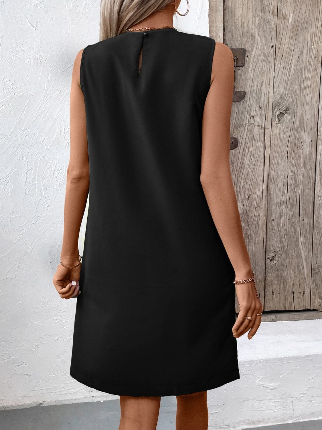 Pocketed Round Neck Sleeveless Mini Dress.