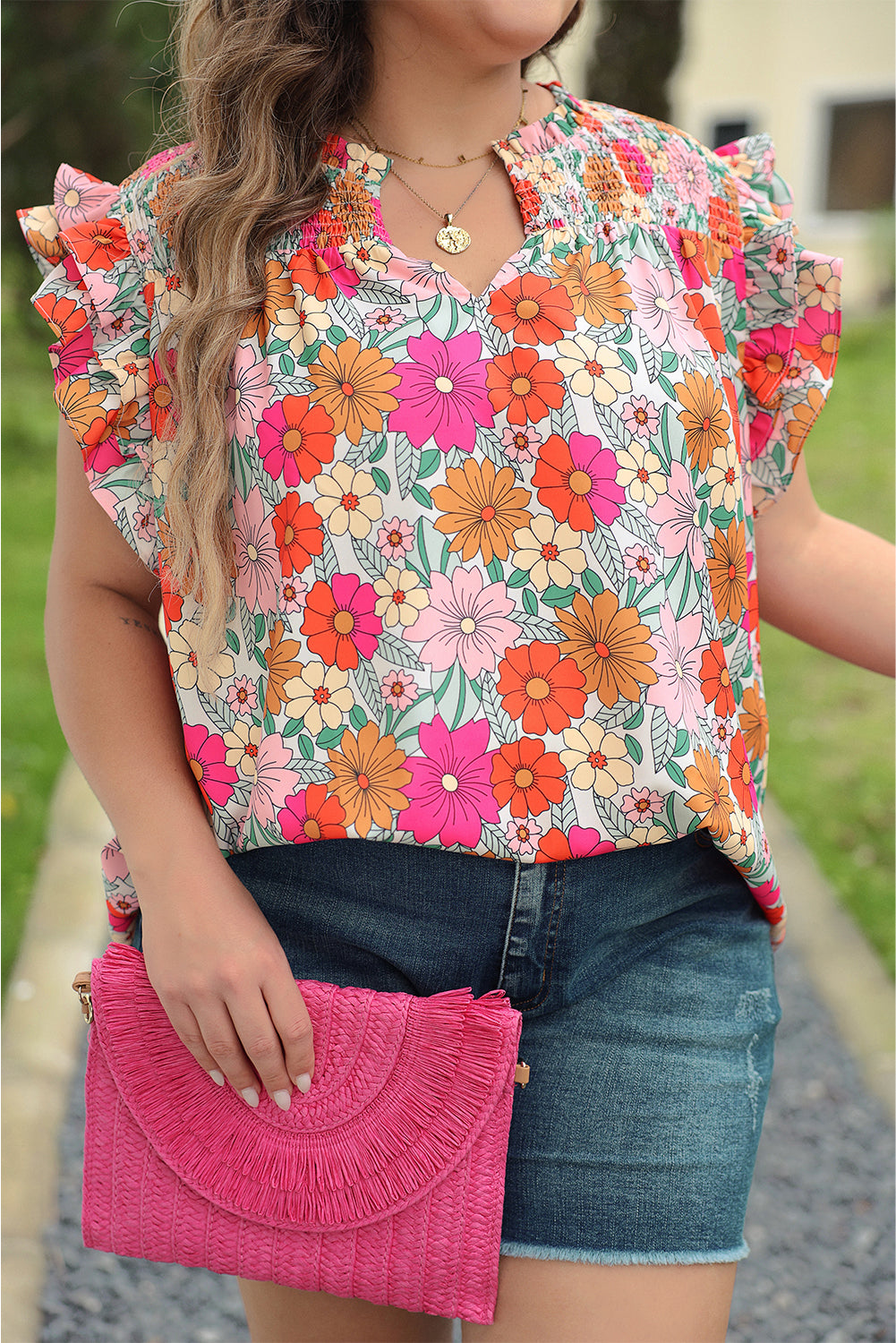 Vibrant floral plus-size ruffle sleeve blouse with notched neckline