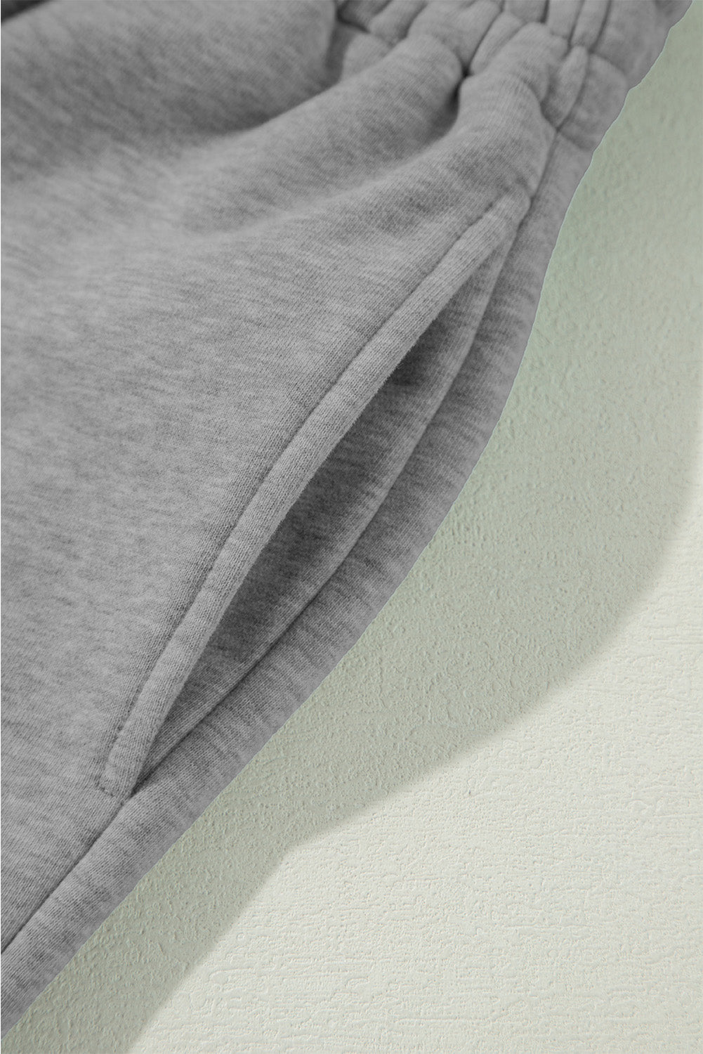 Light grey fleece pants with drawstring