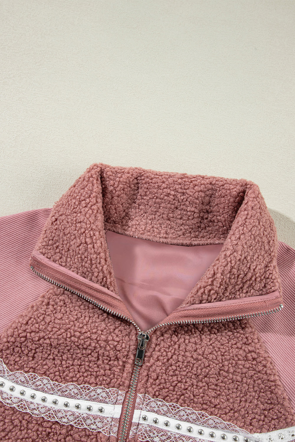 Cozy rose pink sherpa jacket with lace detailing and zip-up style