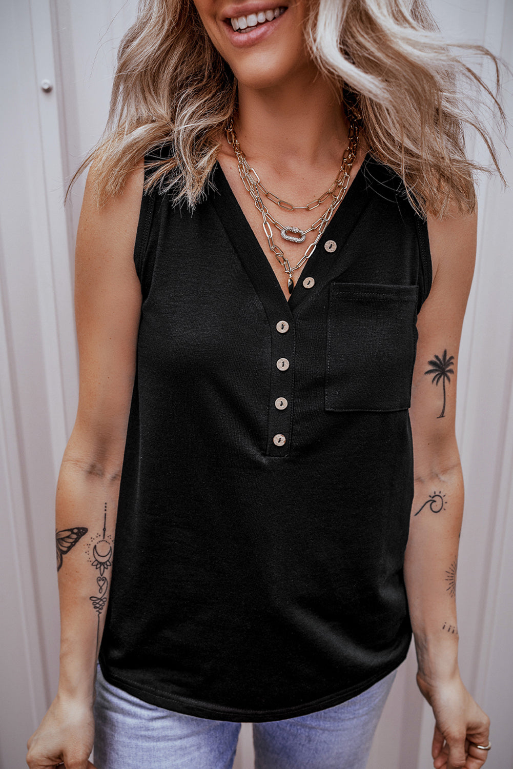 Chic black v-neck tank top with half buttons and patched pocket