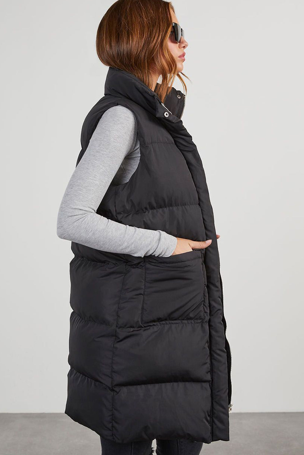 Stylish black longline windproof puffer vest with convenient pockets