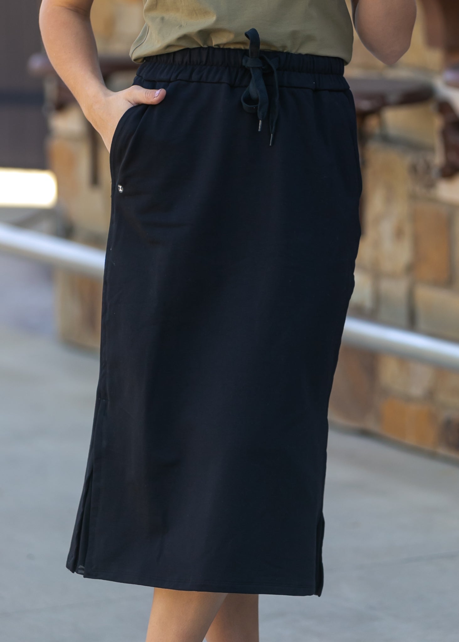Detailed view of the Inherit Co. Abbie Mesh Detail Knit Midi Skirt's soft, breathable knit and mesh fabric.
