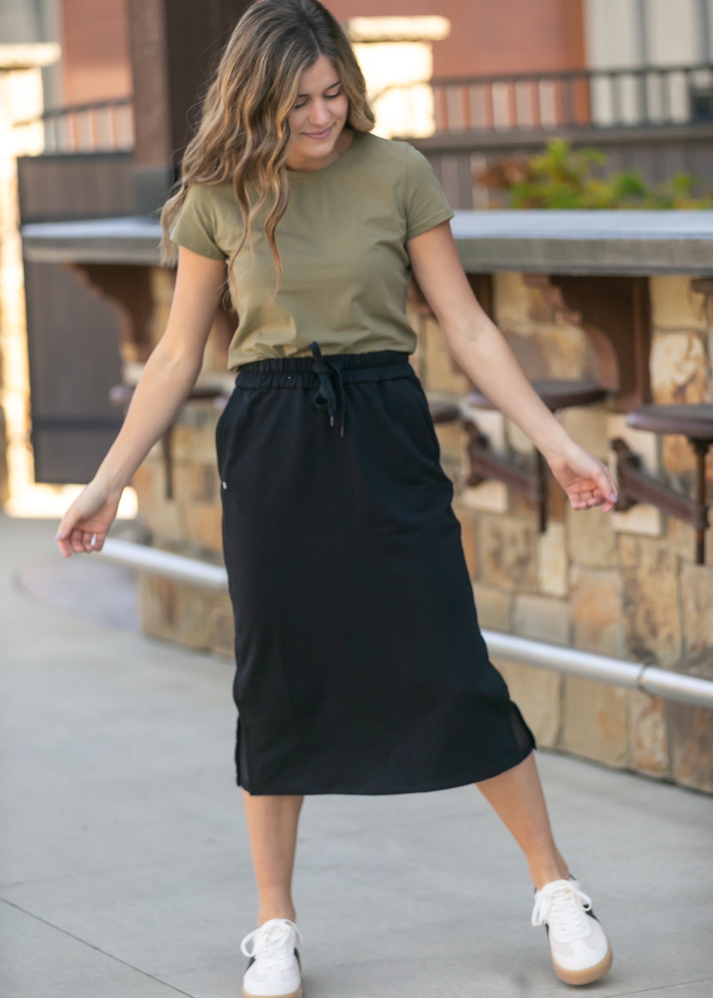 Inherit Co. Abbie Mesh Detail Knit Midi Skirt, showing the comfortable elastic waistband and elegant midi length.