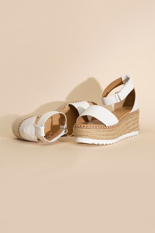 TUCKIN-S PLATFORM SANDALS.