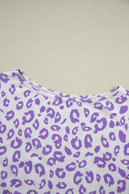 Cozy purple leopard print top with boat neck and drop shoulders