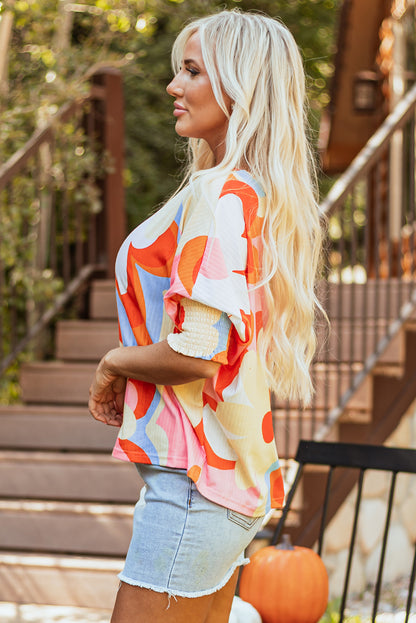 Floral charm: Yellow ribbed blouse with shirred sleeves