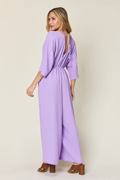 Double Take Full Size Surplice Wide Leg Jumpsuit with Pockets.