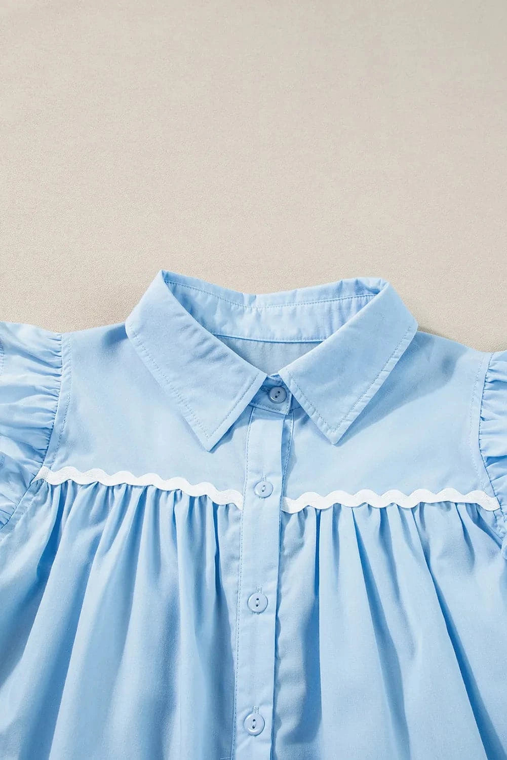 Ruffled Collared Neck Cap Sleeve Shirt.