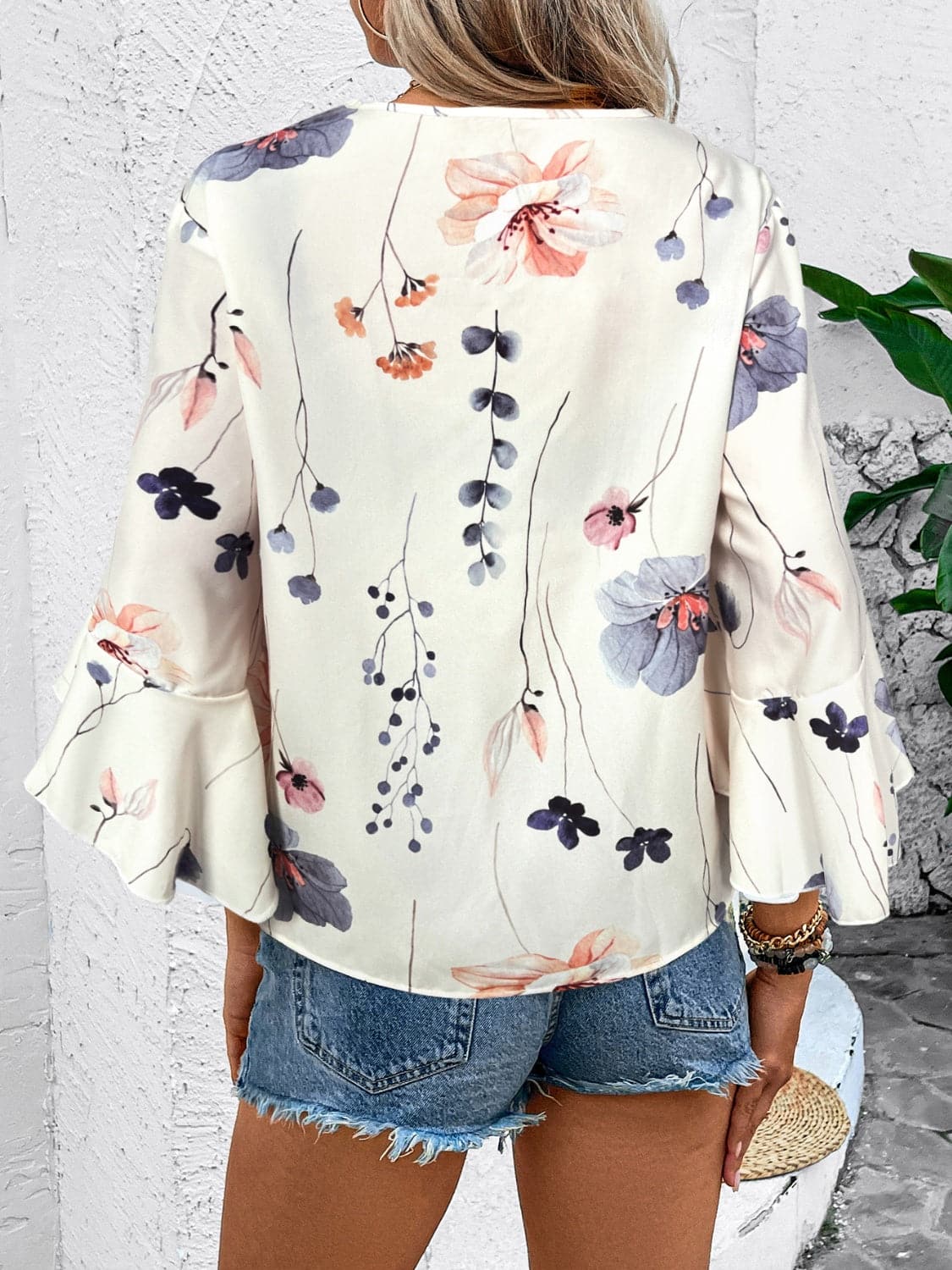 Ruffled Printed V-Neck Half Sleeve Blouse.