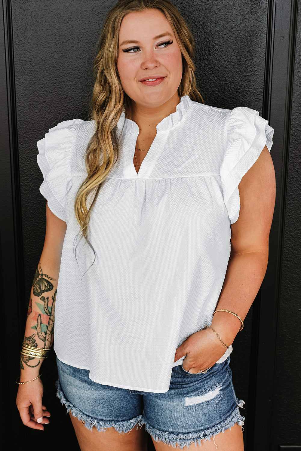 Elegant white plus size blouse with textured ruffles and flutter sleeves