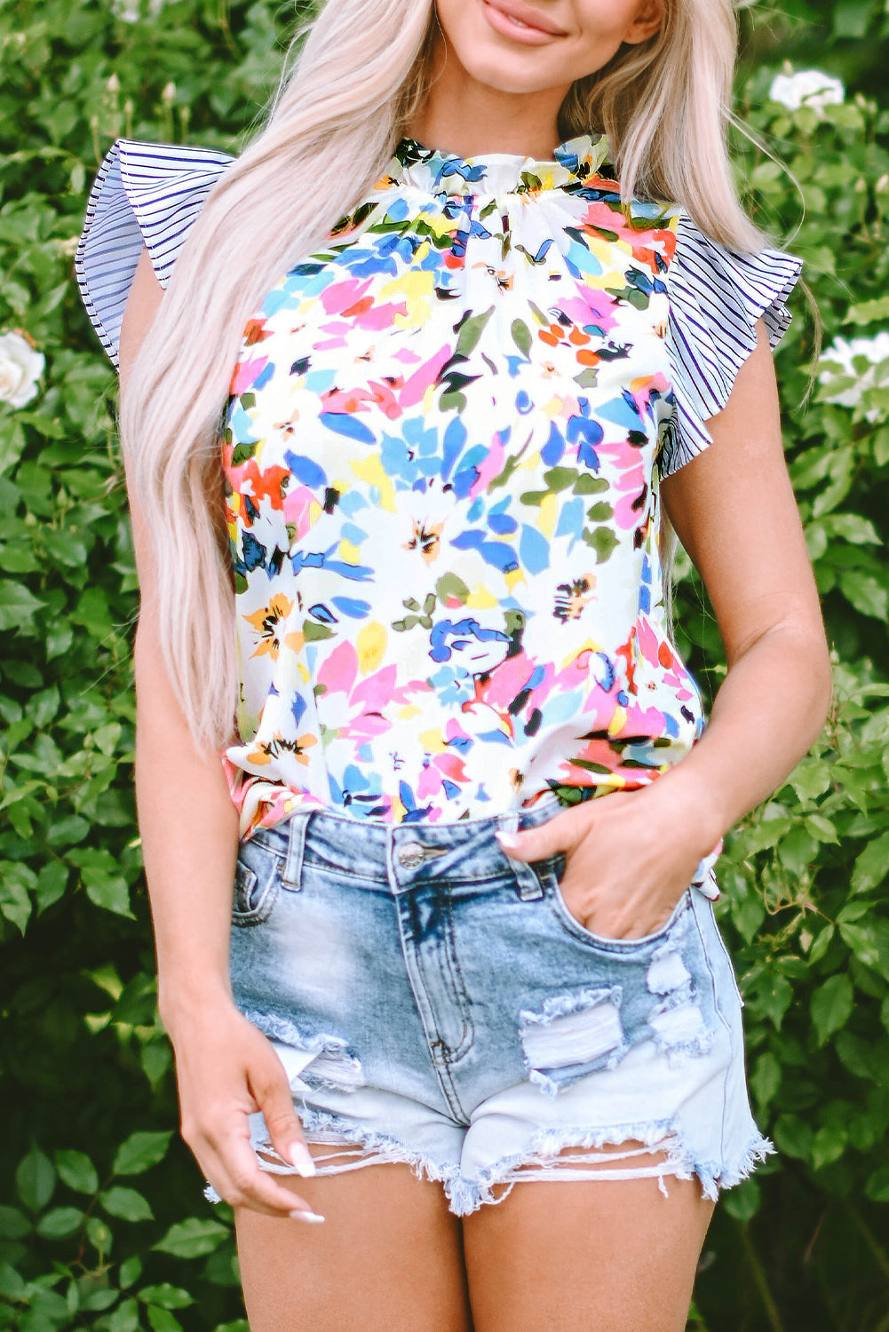 Charming light blue floral blouse with ruffled sleeves and striped accents