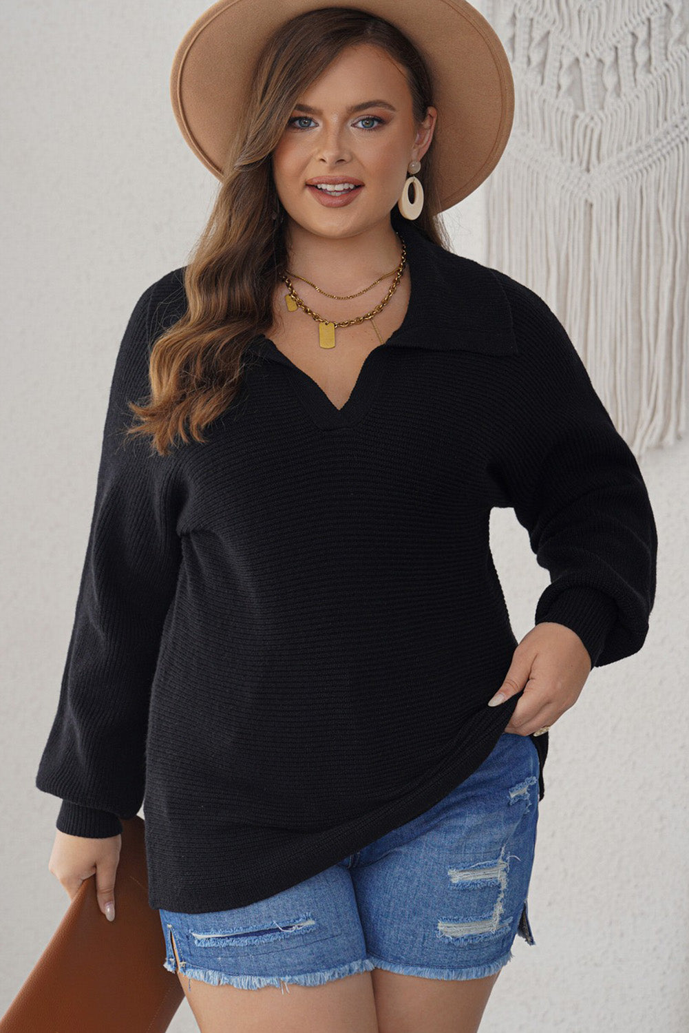 Curvy elegance: Black ribbed knit lapel sweater