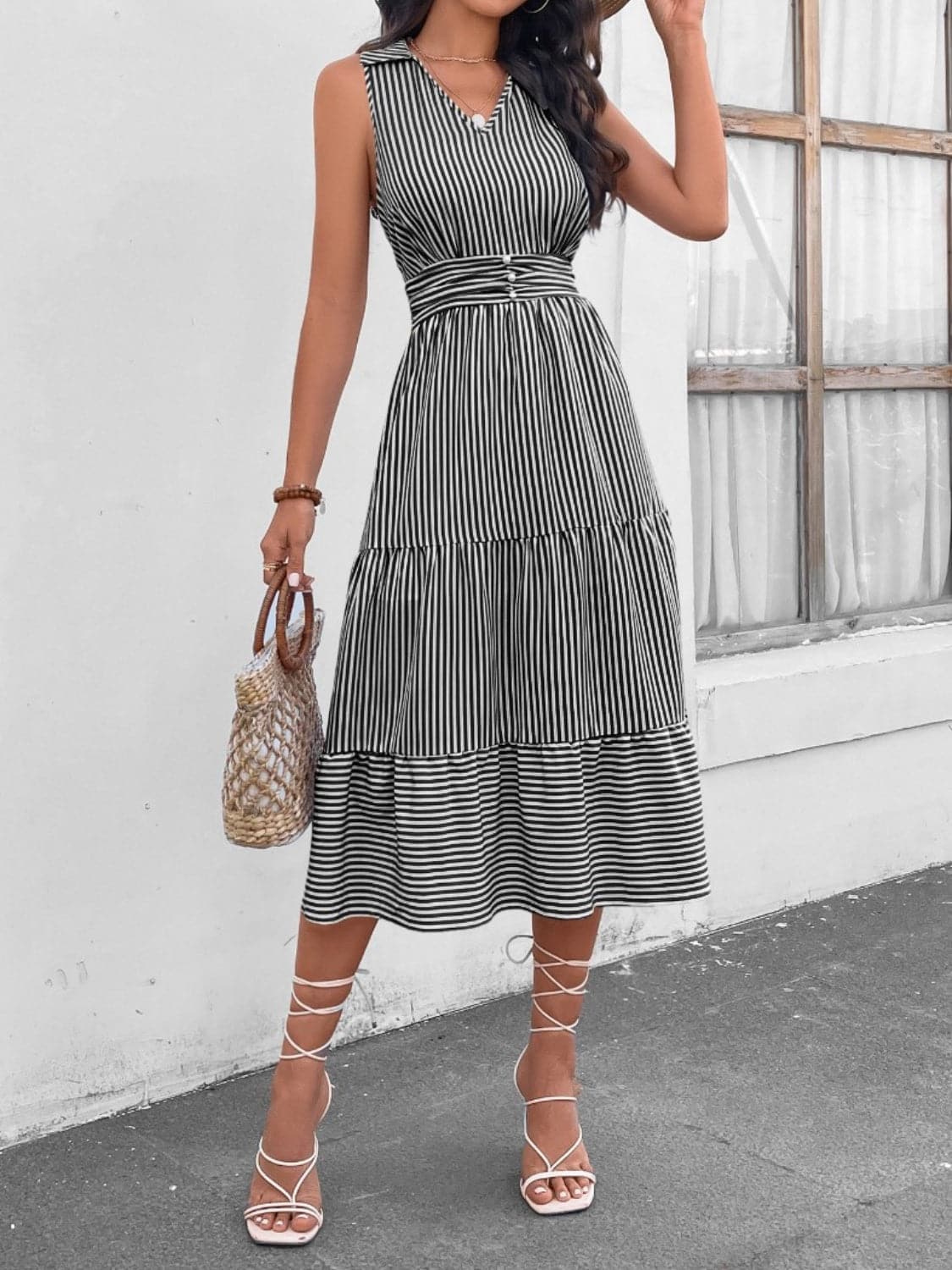 Chic striped midi dress with decorative buttons and collar, 100% polyester.