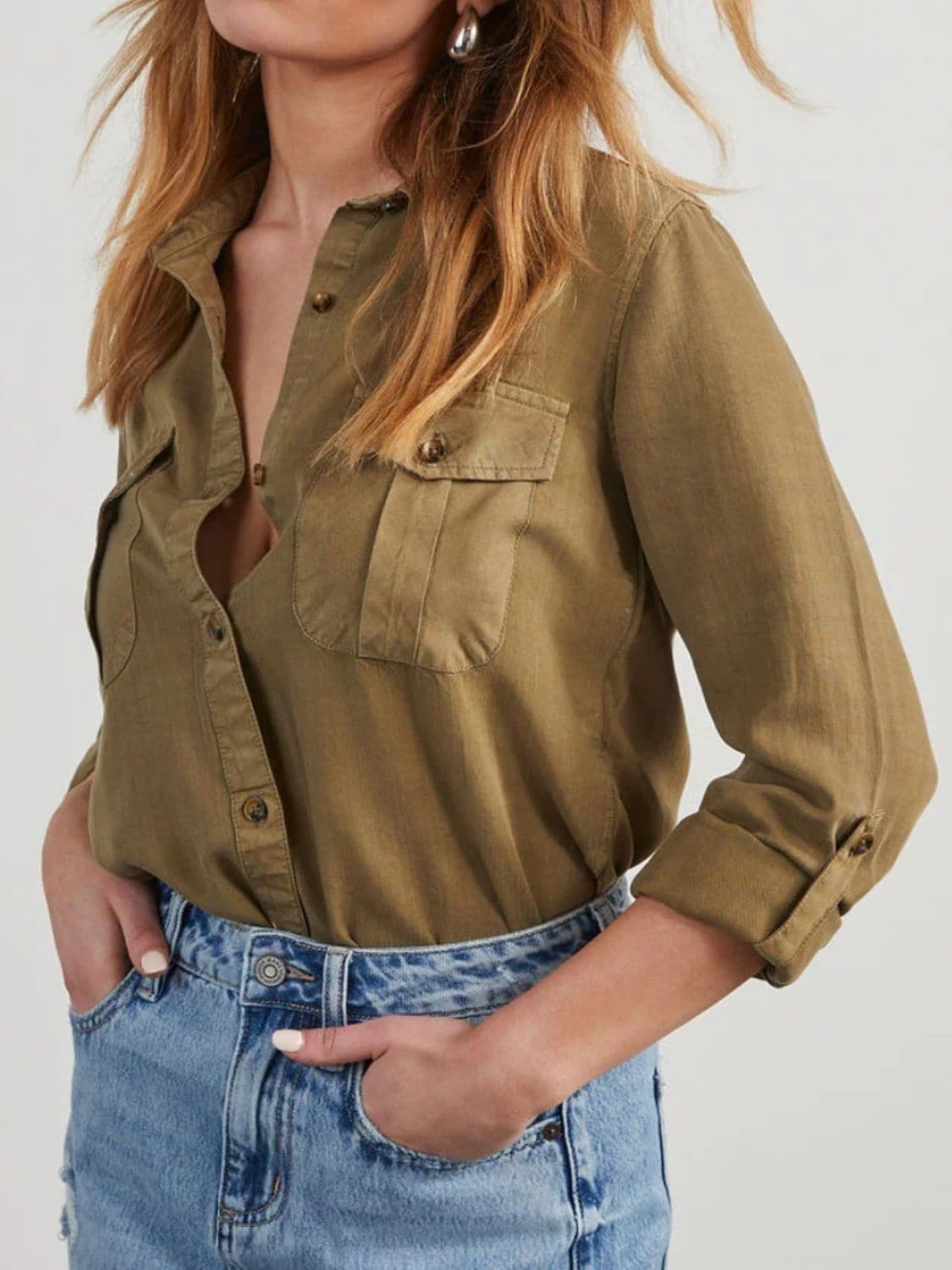 Chic collared denim top with roll-tab sleeves