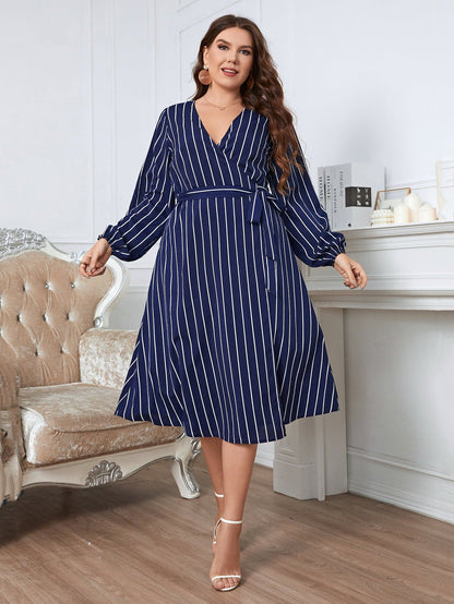 Melo Apparel Plus Size Striped Surplice Neck Long Sleeve Dress.