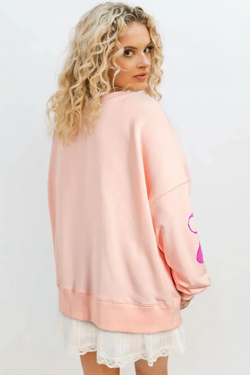 Apricot Pink Sequined Bowknot Drop Shoulder Oversized Sweatshirt - Love Salve 