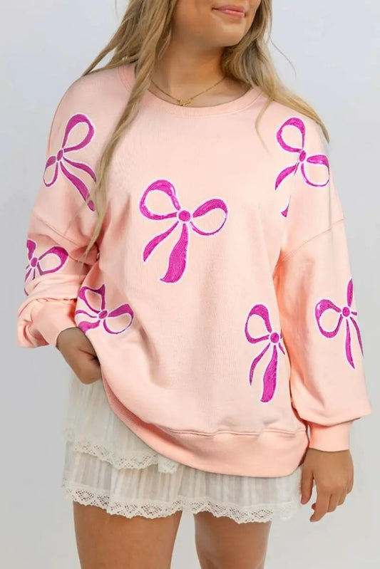 Apricot Pink Sequined Bowknot Drop Shoulder Oversized Sweatshirt - Love Salve 