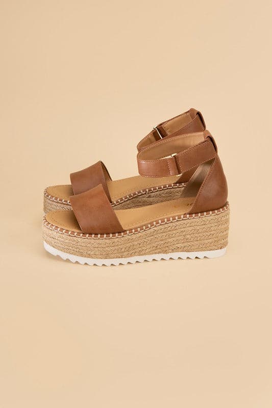 TUCKIN-S Platform Sandals.