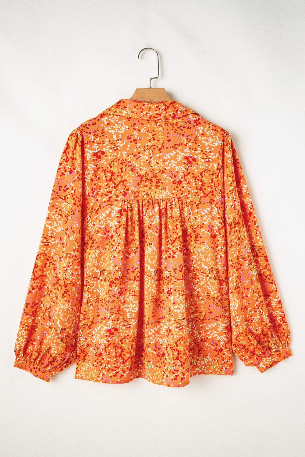 Vibrant orange abstract print collared babydoll blouse for effortless style