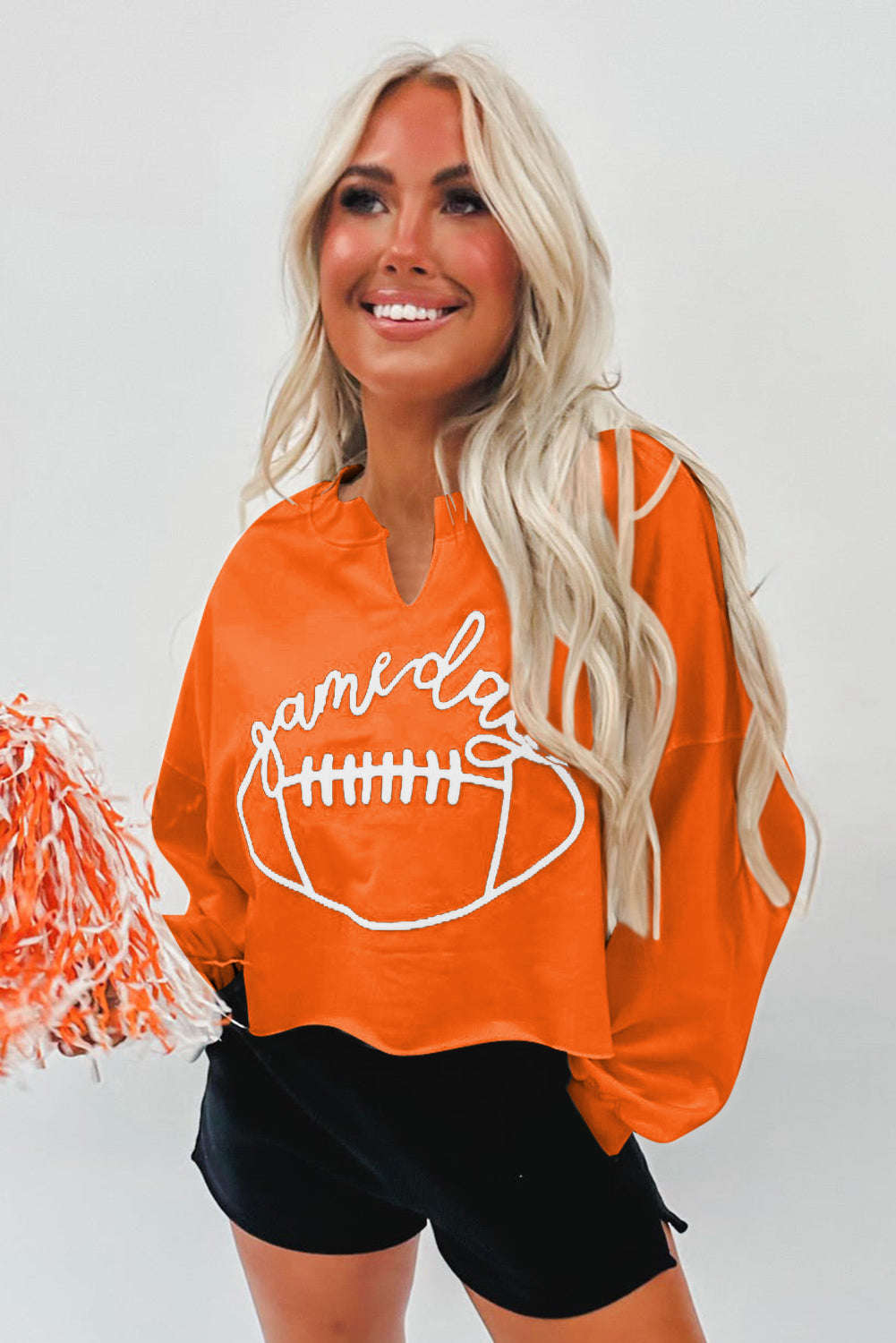 Cheer on game day with our stylish orange rugby sweatshirt