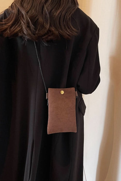 Chic mini suede crossbody bag with snap closure