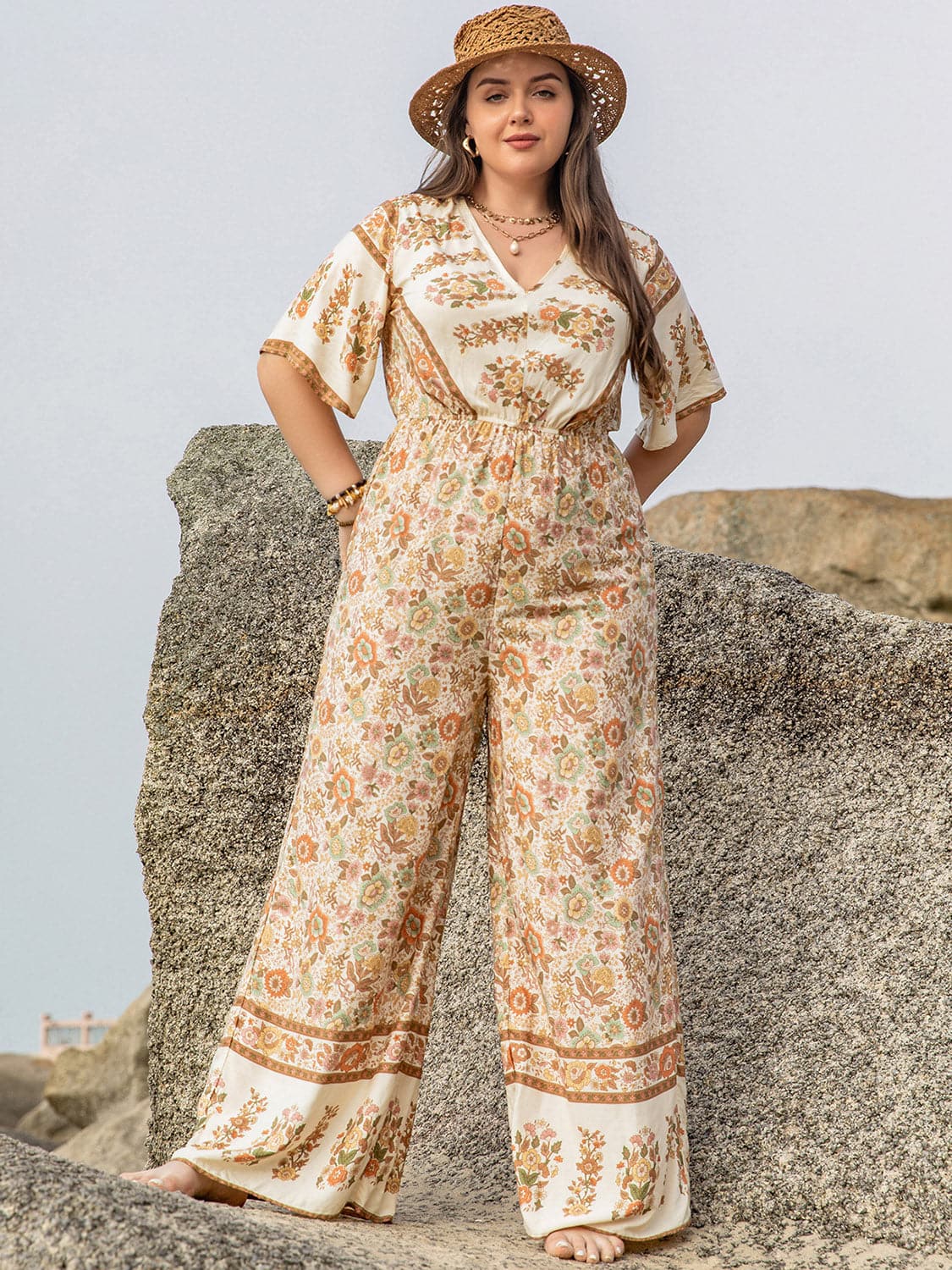 Plus Size V-Neck Flutter Sleeve Wide Leg Jumpsuit.