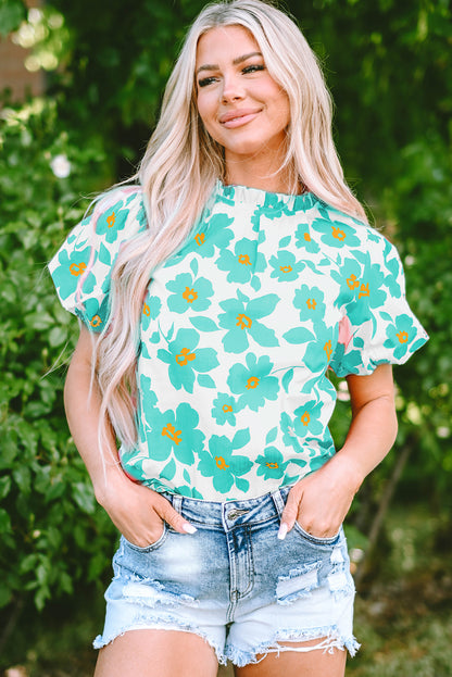 Chic green floral blouse with puff sleeves and frilled neckline