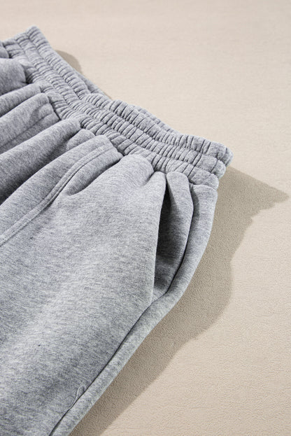 Stylish gray hoodie and joggers set with exposed seams