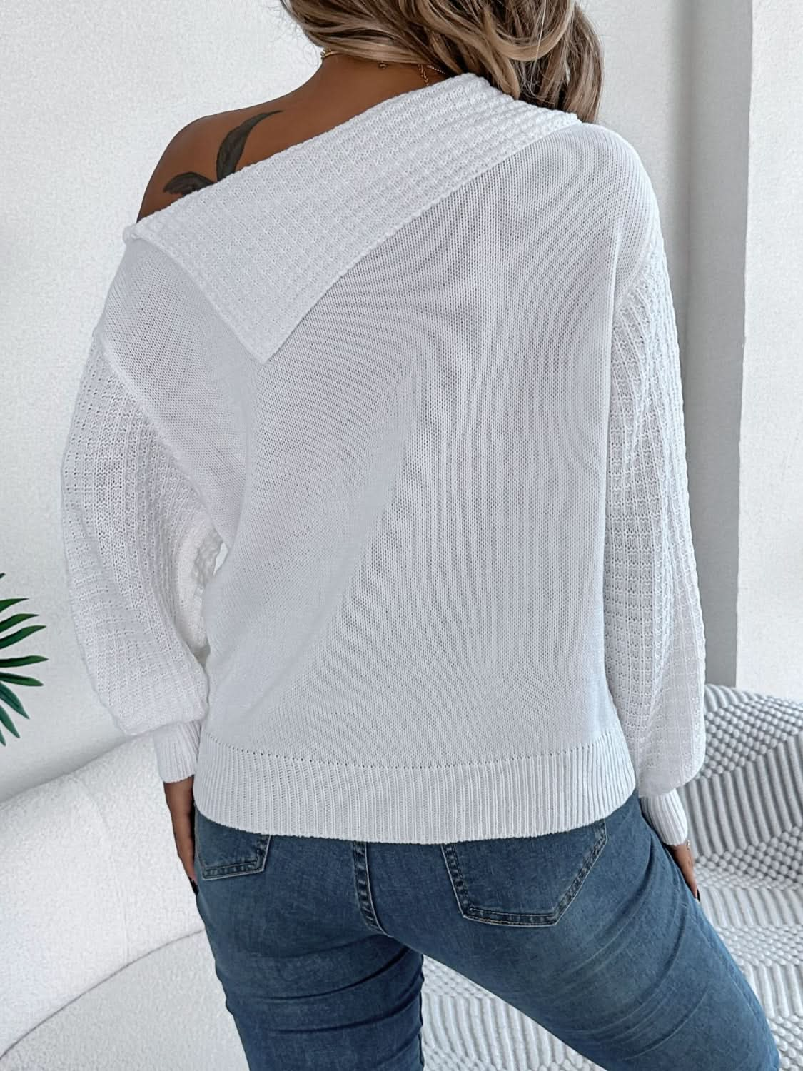 Asymmetrical cable-knit long sleeve sweater