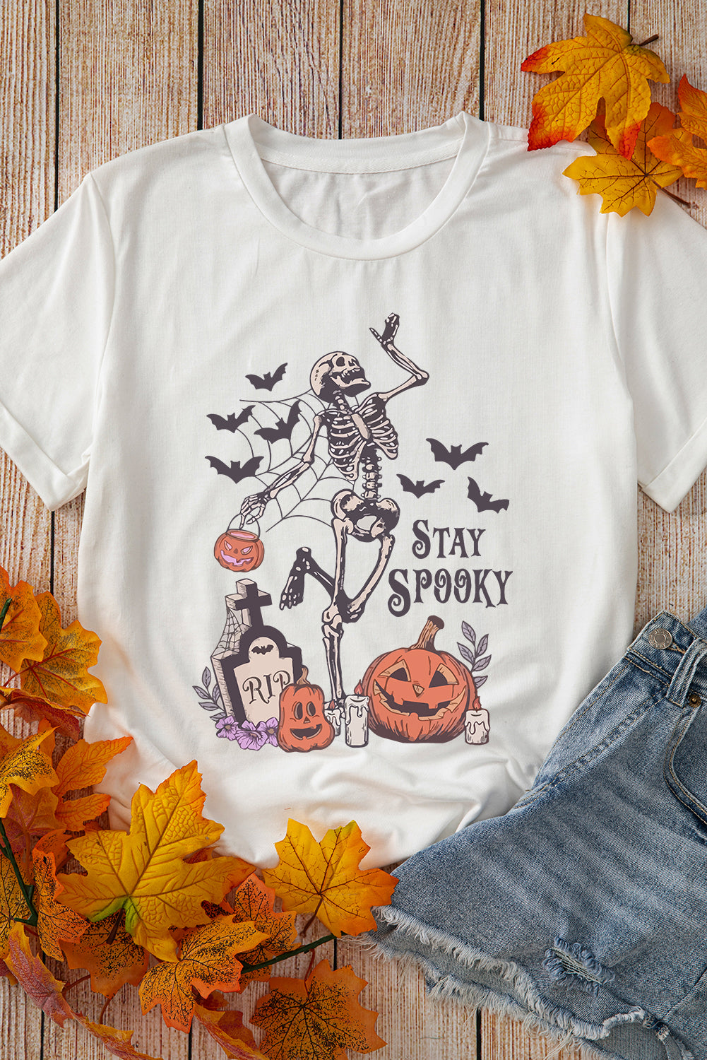 Stay spooky graphic tee featuring a skull pumpkin design for Halloween fun