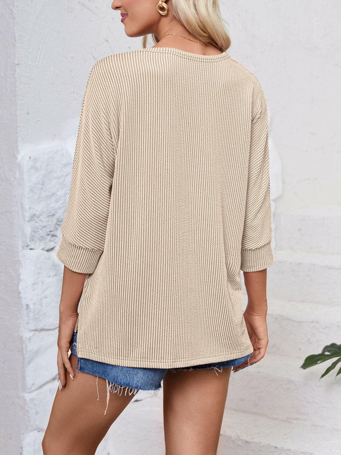 Textured Round Neck Three-Quarter Sleeve Blouse.