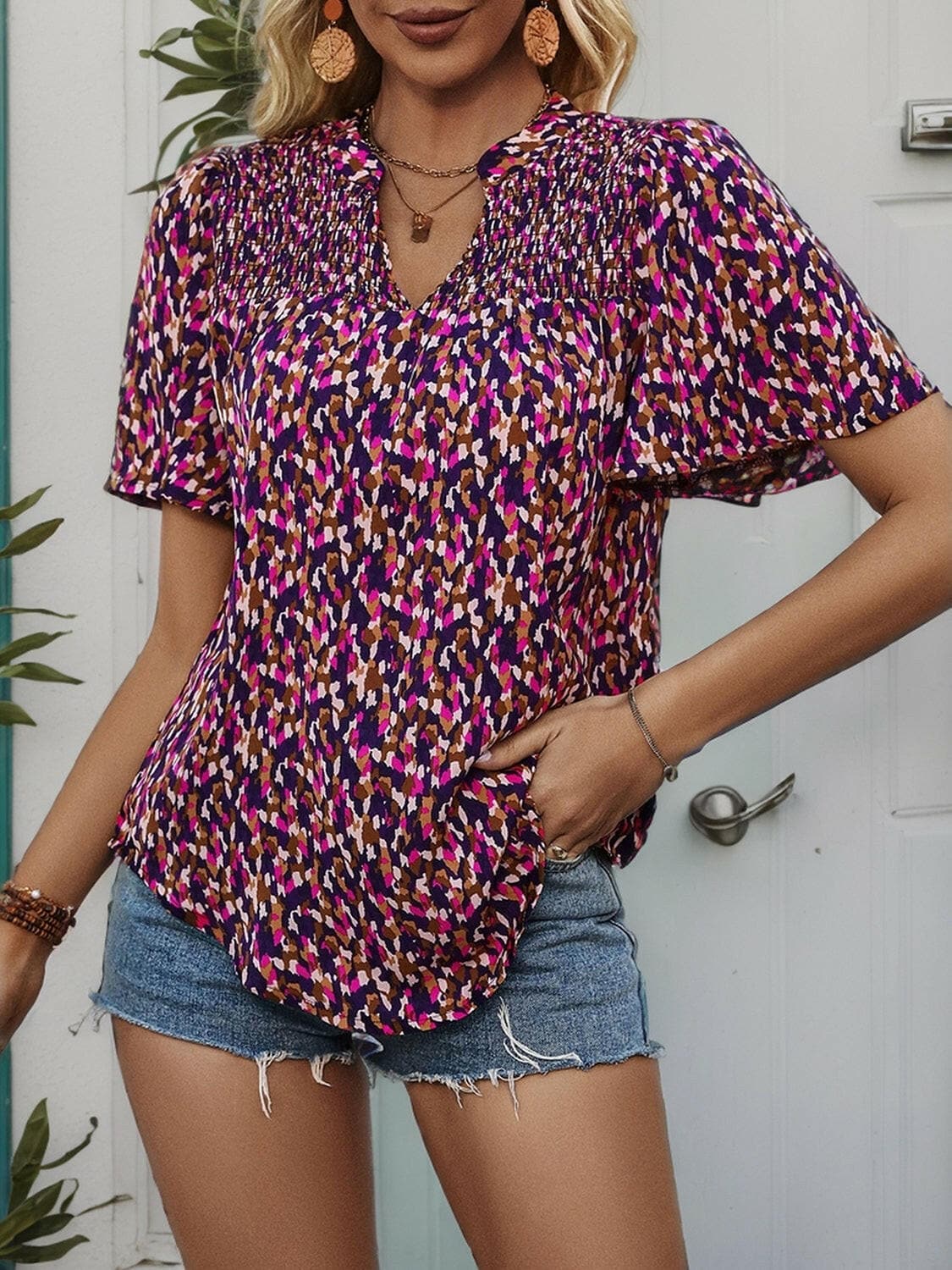 Printed Notched Flutter Sleeve Blouse.