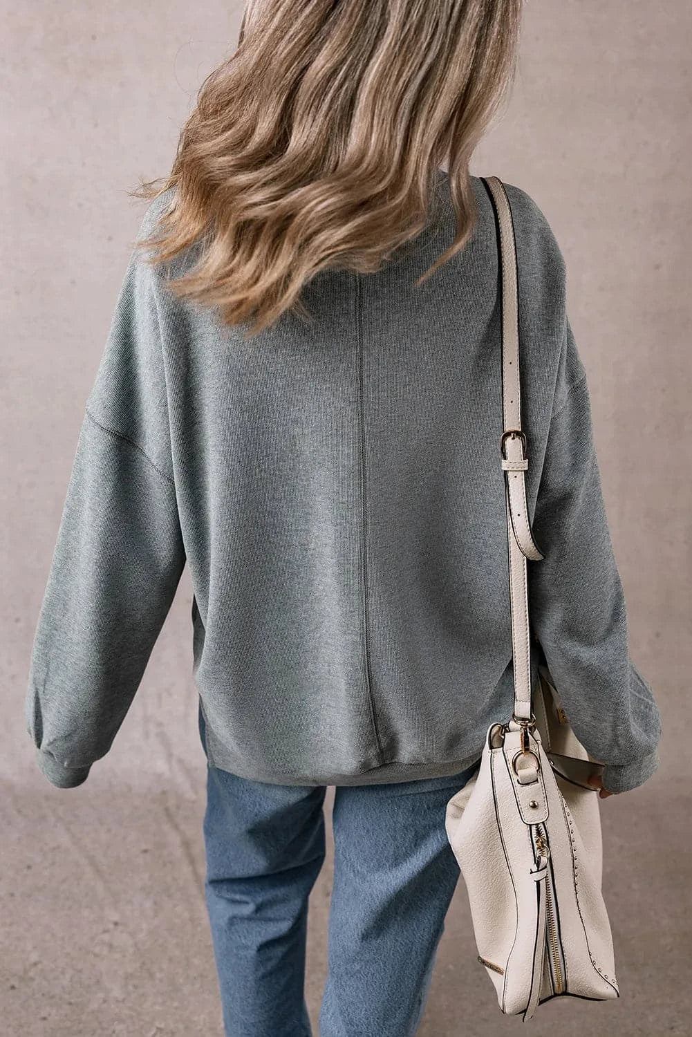 Slit Round Neck Long Sleeve Sweatshirt.