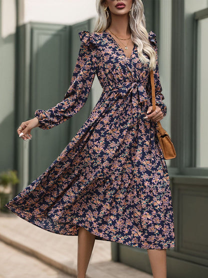 Chic Printed Surplice Dress with Tied Sheer Elegance