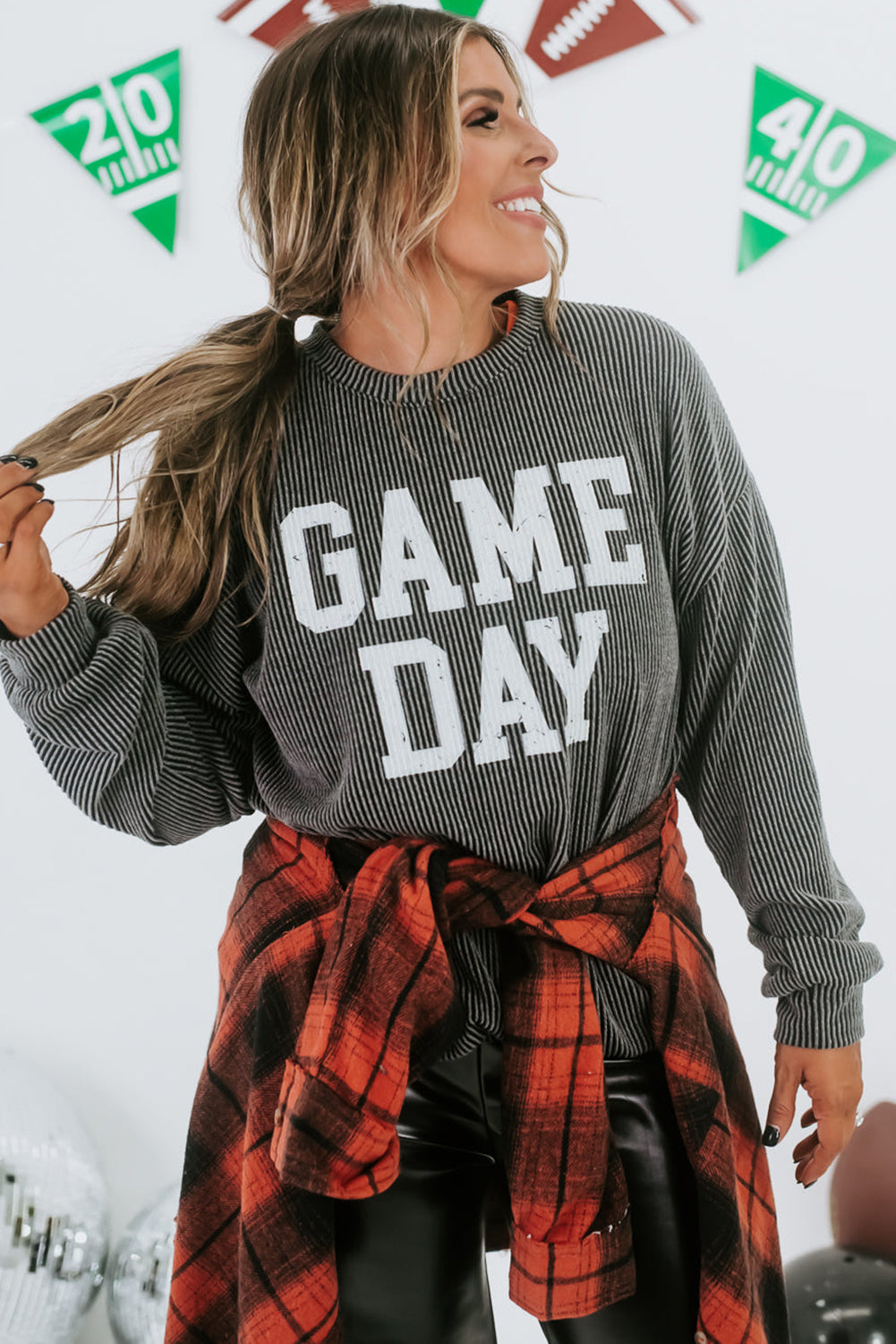 Game day ready: Dark grey corded graphic long sleeve crewneck top