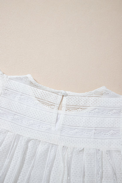 Lace-trimmed white flowy tank top with ruffled accents